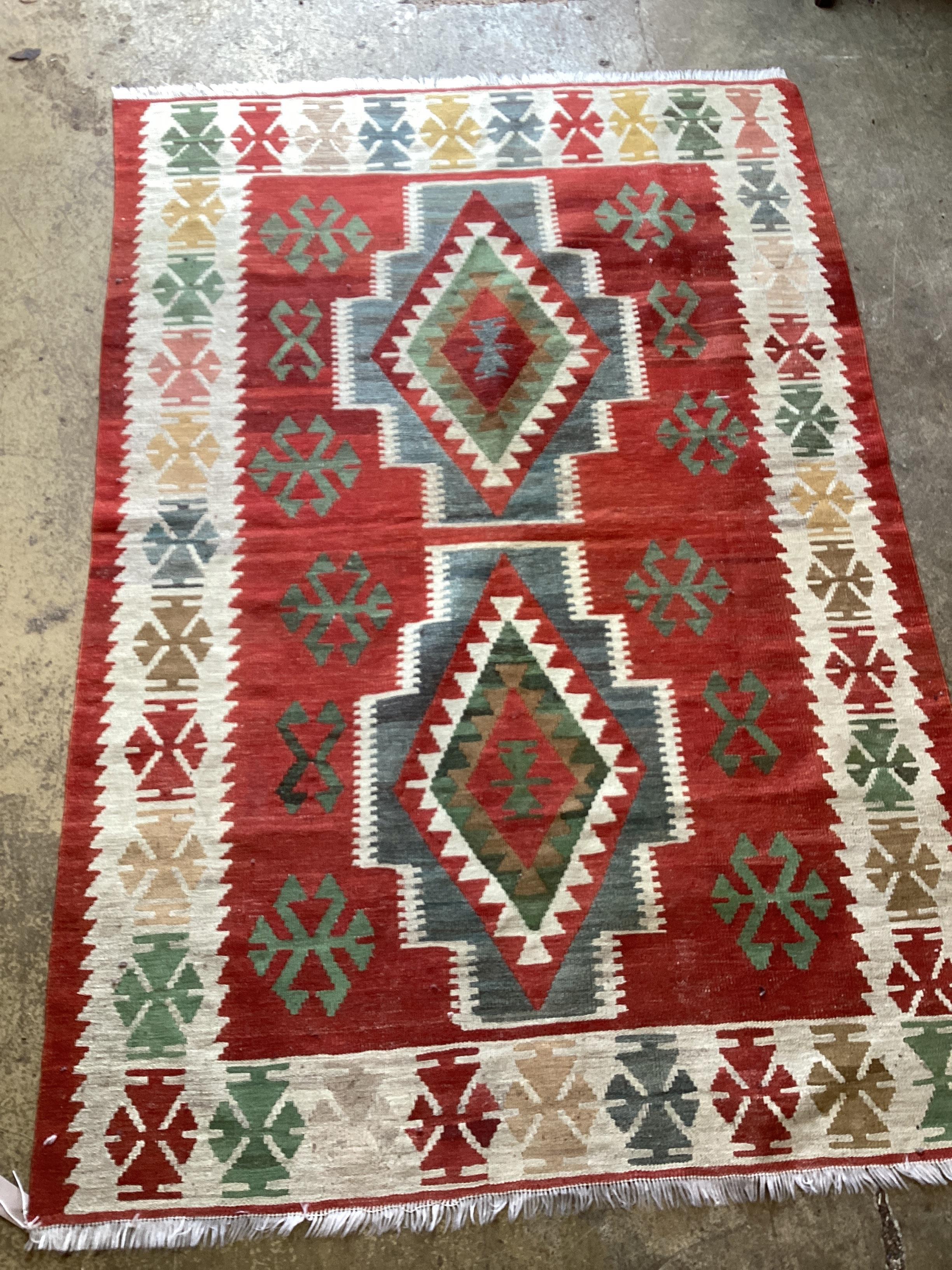 A Kilim polychrome geometric rug, 194 x 129cm